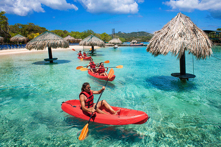 Friends kayaking in the Caribbean.
