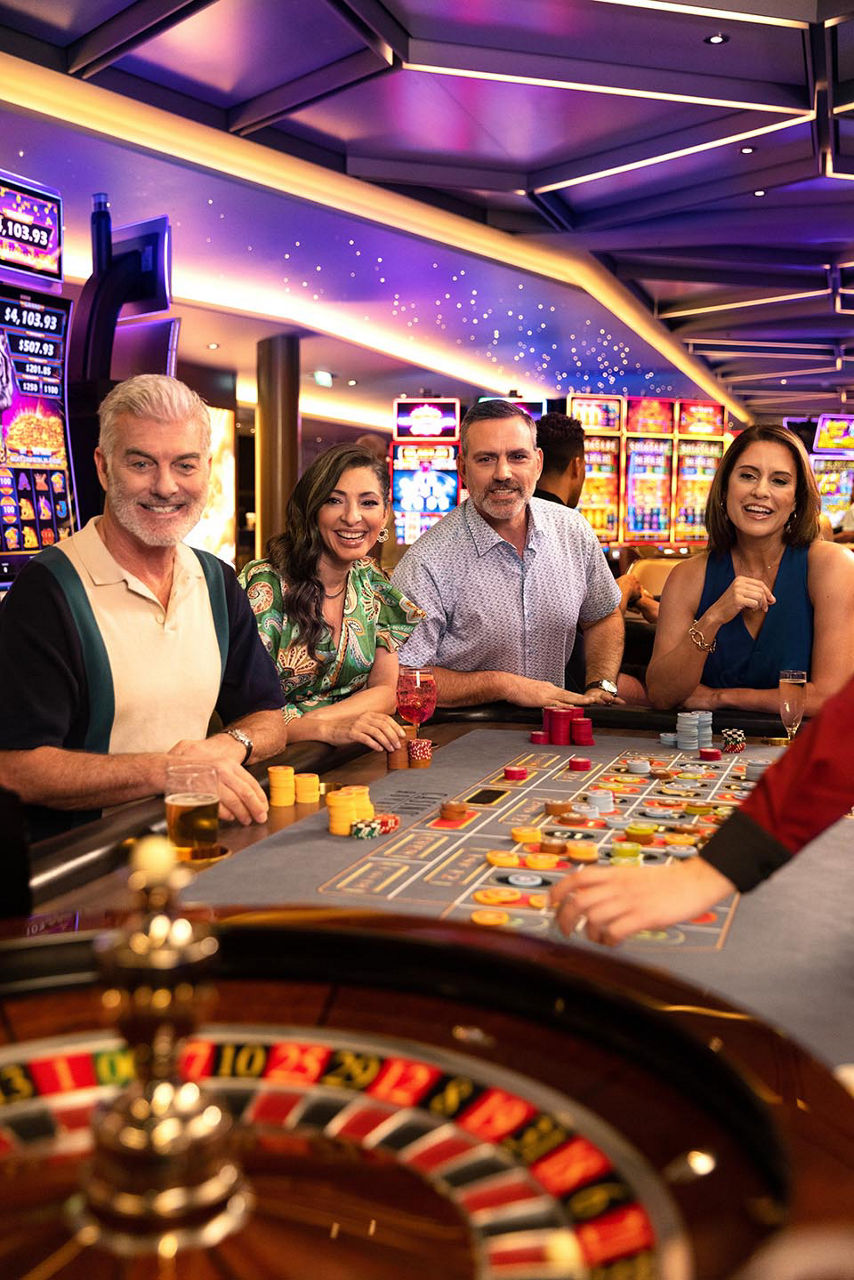 WN, Wonder of the Seas, casino, lifestyle, group of friends playing roulette, senior couples, fun, excitement, anticipation,