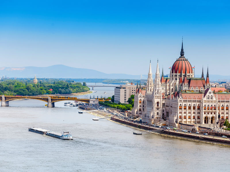 classic view of the famous tourist attraction of Budapest - the Hungarian Parliament and the Danube River with ships