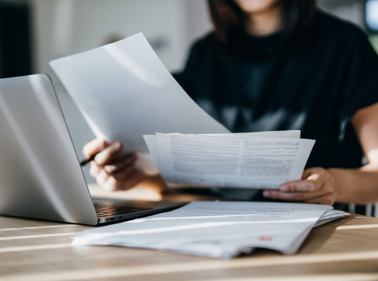 woman looking at insurance documents