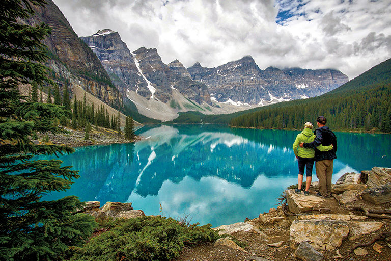 A couple enjoying the view of Moraine lake