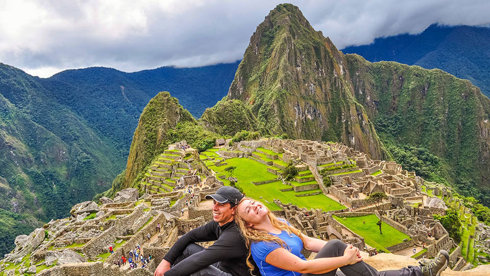 Couple enjoying their vacation and exploring Machu Picchu.