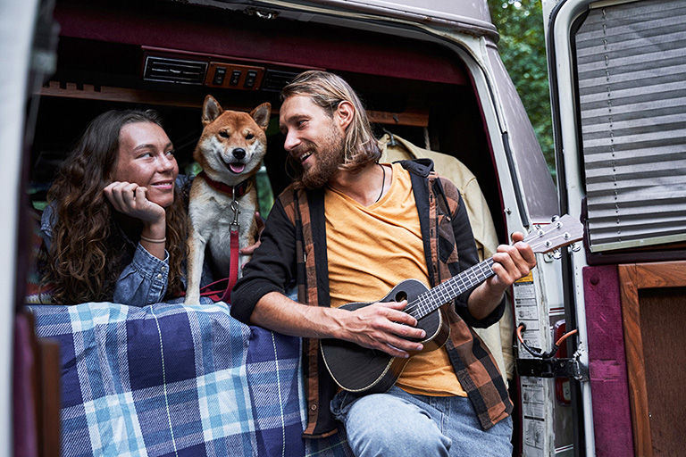 Couple traveling and taking a rest during their roadtrip rediscovering America with AAA.