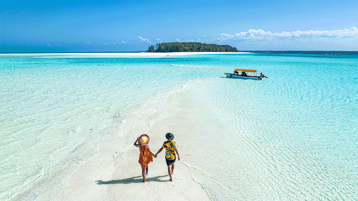 a couple walking on the beach