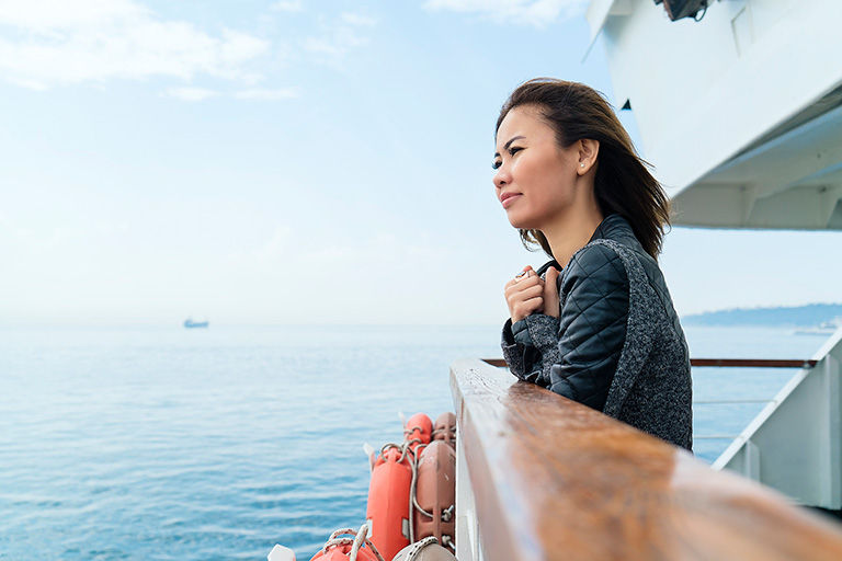 Asian Woman traveling, getting away from it all.