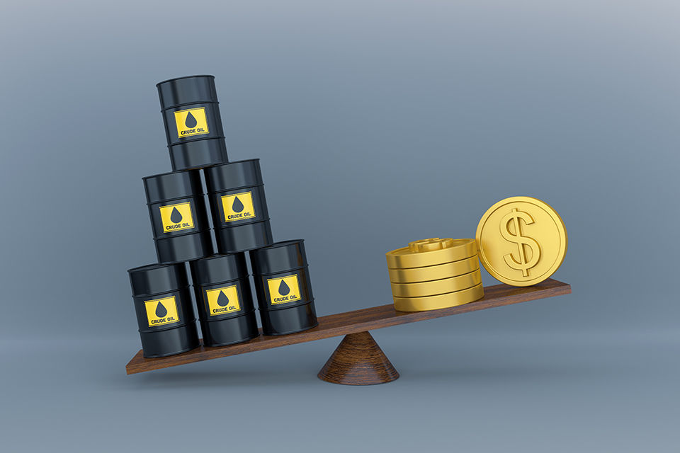 A Computer generated image of crude oil on a seesaw with dollar coins on the other side. A conceptual render showing inflation due to the price rise of crude oil globally.