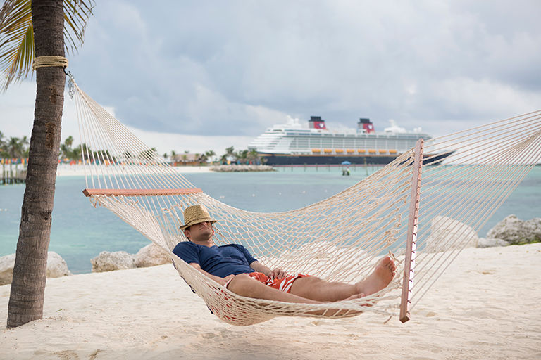 Disney Cruise Line guest relaxing in a hammock in the Bahamas.