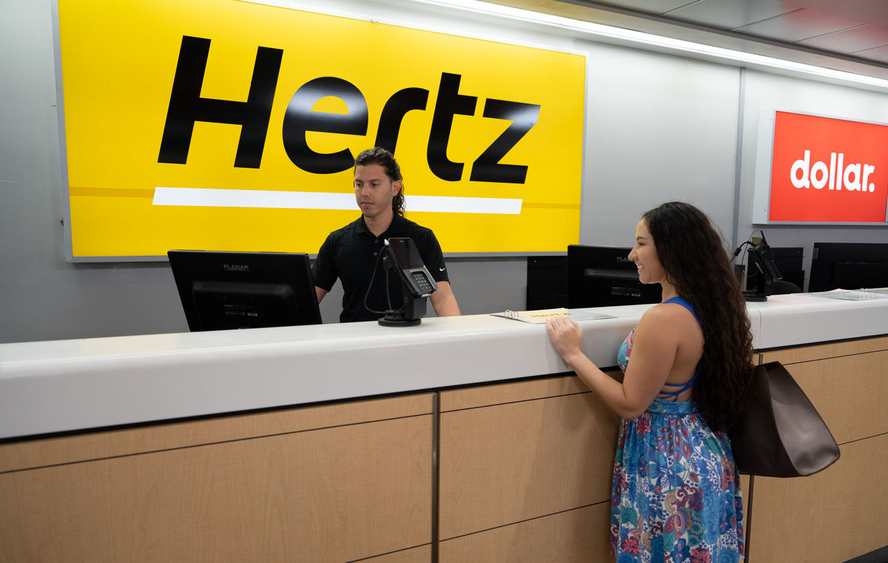 woman at Hertz counter