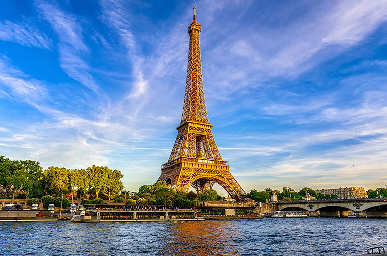 Paris Eiffel Tower and river Seine at sunset in Paris, France. Eiffel Tower is one of the most iconic landmarks of Paris..