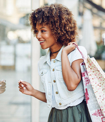 Woman looking into shop window