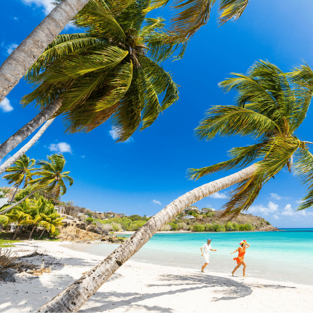 Happy little boy with family running on tropical beach, Antigua, Leeward Islands, Caribbean, West Indies