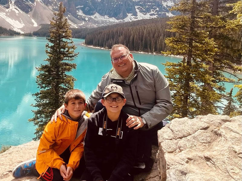 Chris Wommer and two boys on a Family travel adventure