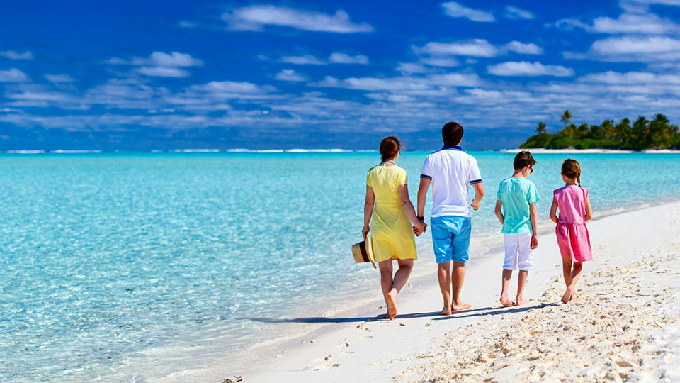 Family Walking On Beach