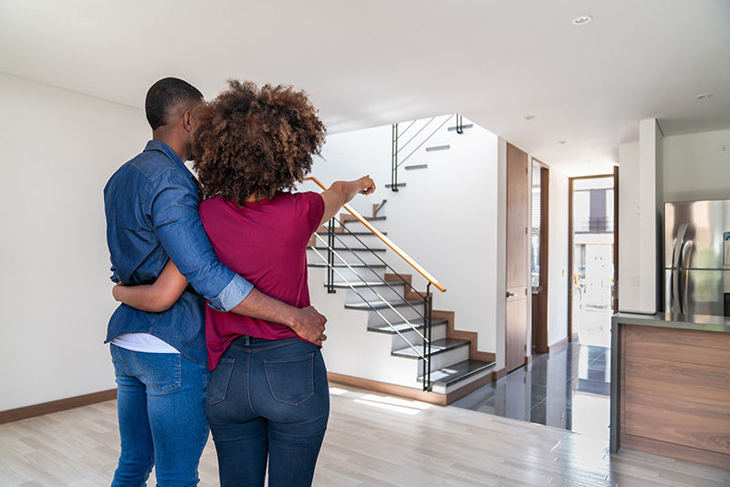 A young couple looking at a new home to purchase