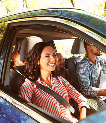 Family in vehicle driving