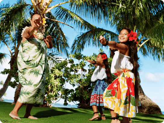 woman hula dancing with two girls