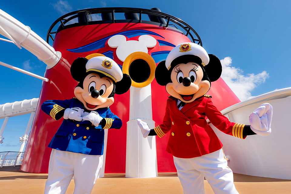 Mickey and Minnie Mouse in ship captain outfits on a Disney cruise ship