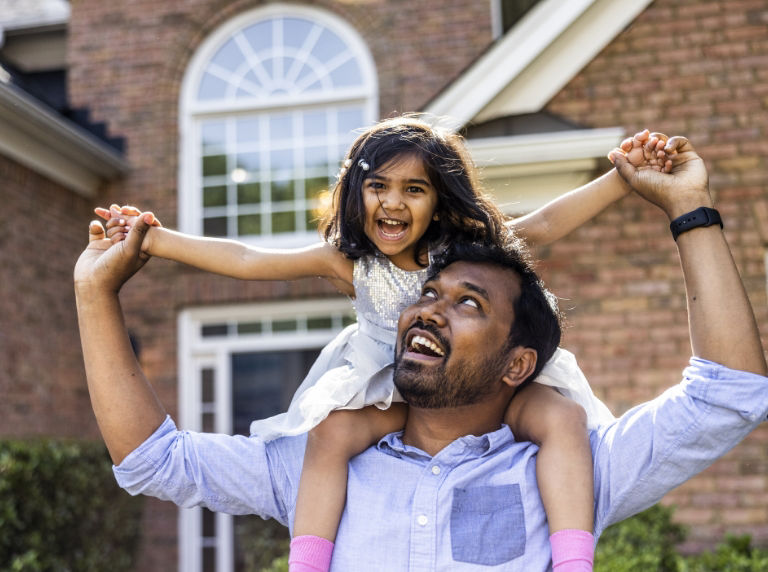 Father and daughter smiling