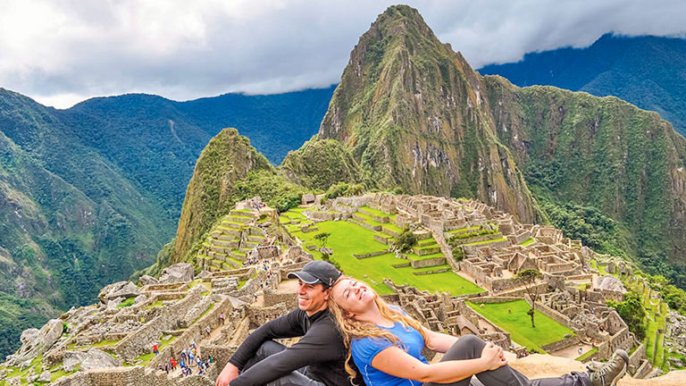 Couple exploring Machu Picchu.