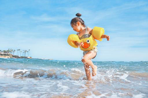A kid enjoying in beach 