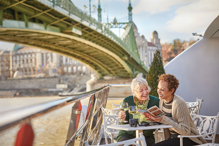 Two friends in Europe looking at a map