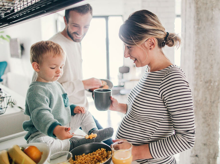 family in the kitchen making breakfast
