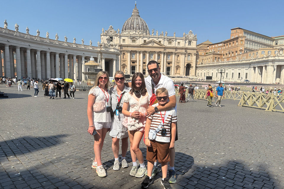 A Family Enjoying Scenic View at Mountain Lake