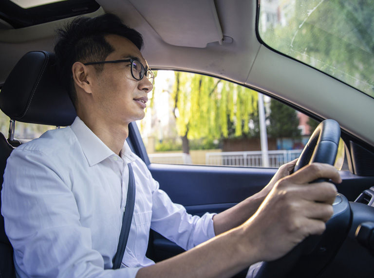 Man driving his car