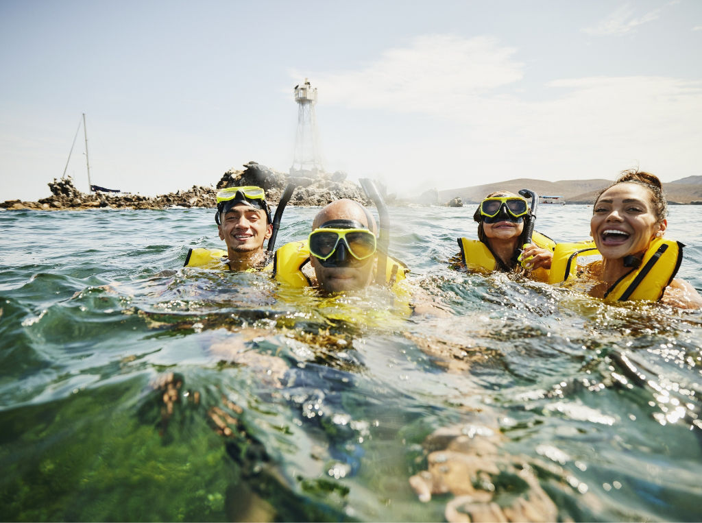 Family scuba in water