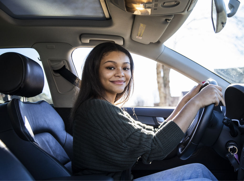 young woman driving a car.