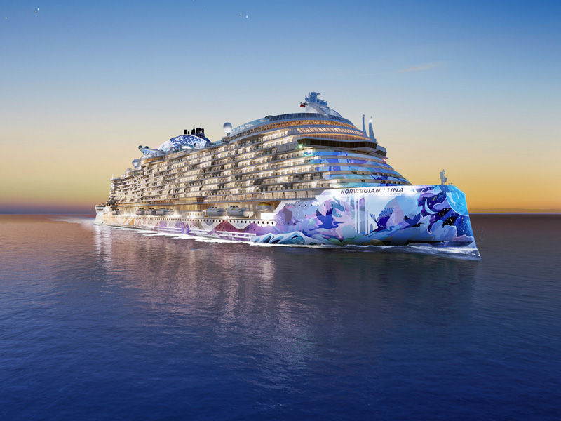 A Norwegian cruise line ship in a calm sea