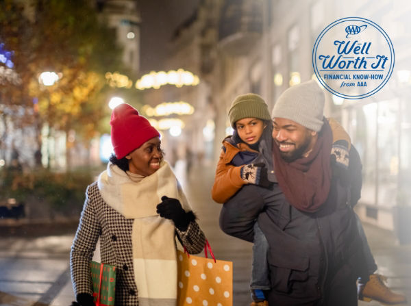 Family walking through city holiday shopping