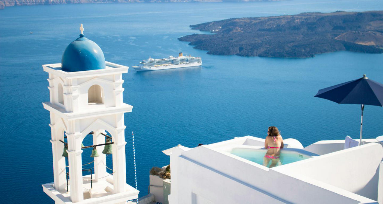 Woman in swim up pool in hotel in Greece