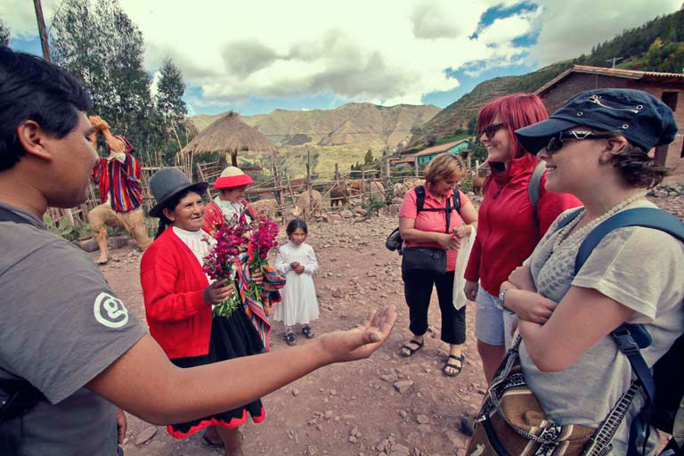 Cultural exchange with indigenous community in traditional Andean highlands setting.