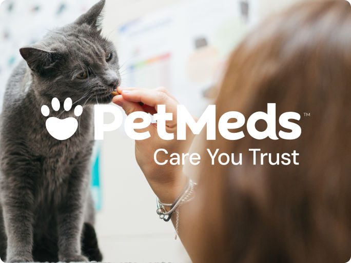 PetMeds logo and tagline "Care You Trust" over a photo of a woman giving a treat to a gray cat.