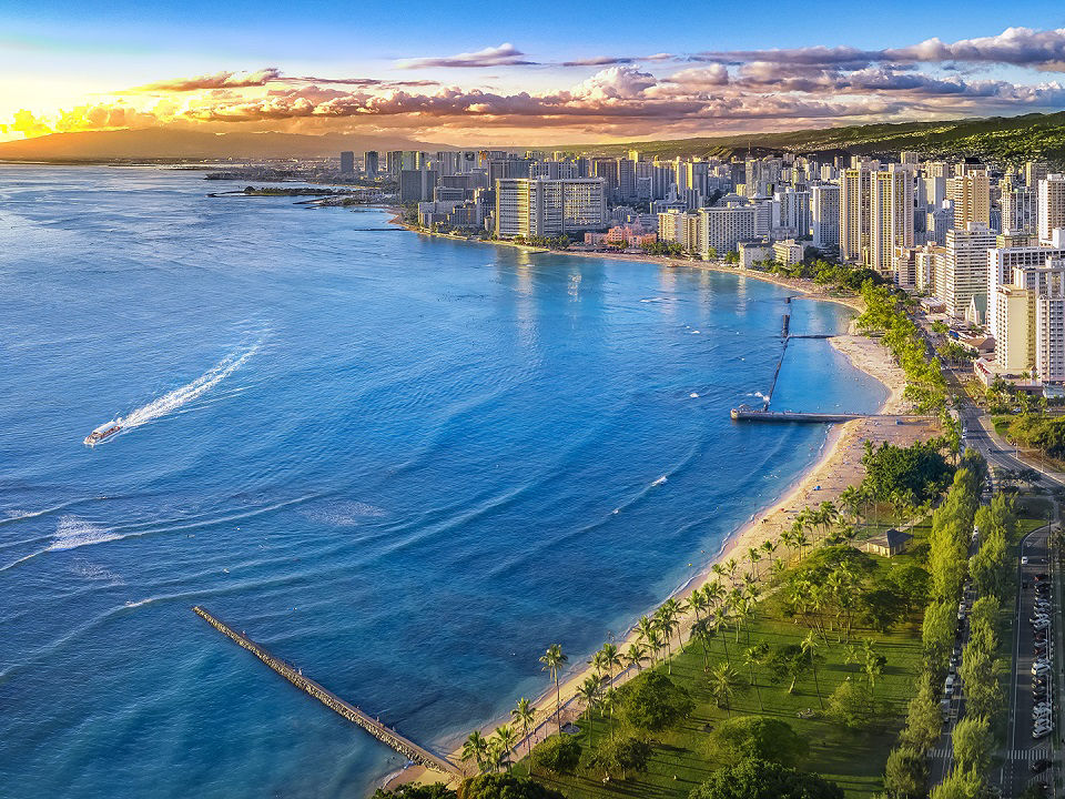 Honolulu, Hawaii aerial view of coastline at sunset.