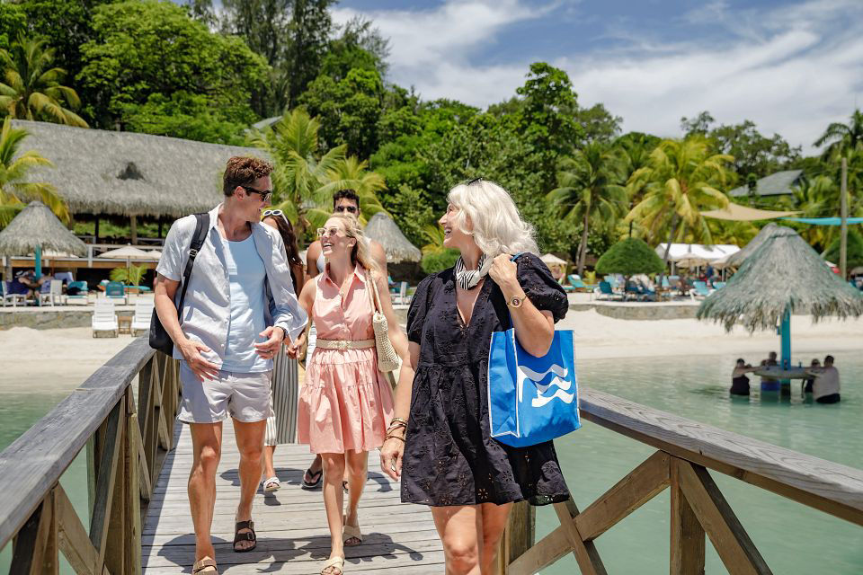 Family walking on a bridge during Caribbean excursion with Princess Cruises.