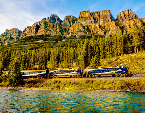 train riding along a river