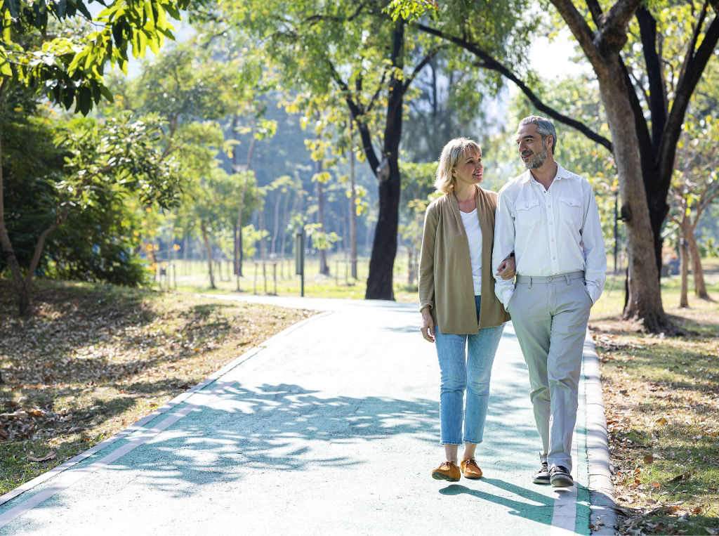 Couple walking in a park. 