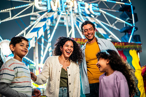 Family talking at amusement park