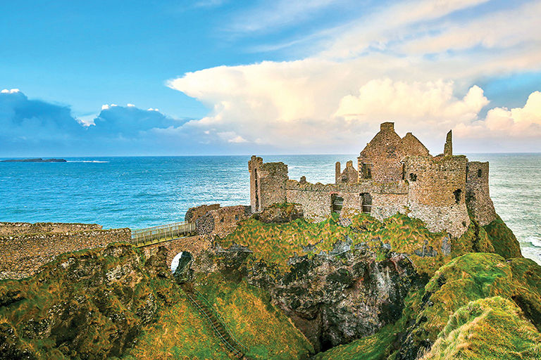 Trafalgar tour, Irish castle on the cliffs with the sea in the background.