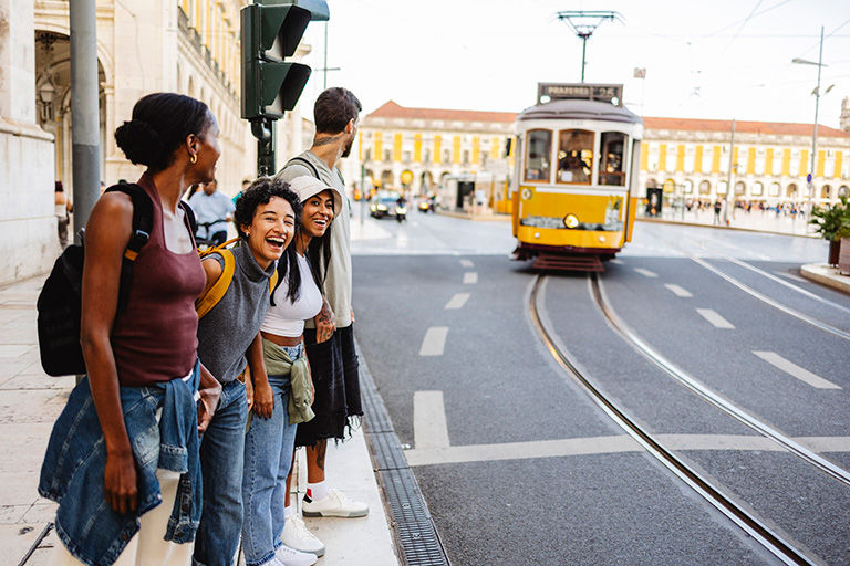 A group of friends walking in Lisbon, Portugal