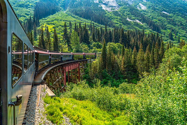 White Pass Summit excursion tour train in the mountains, Alaska, USA.
