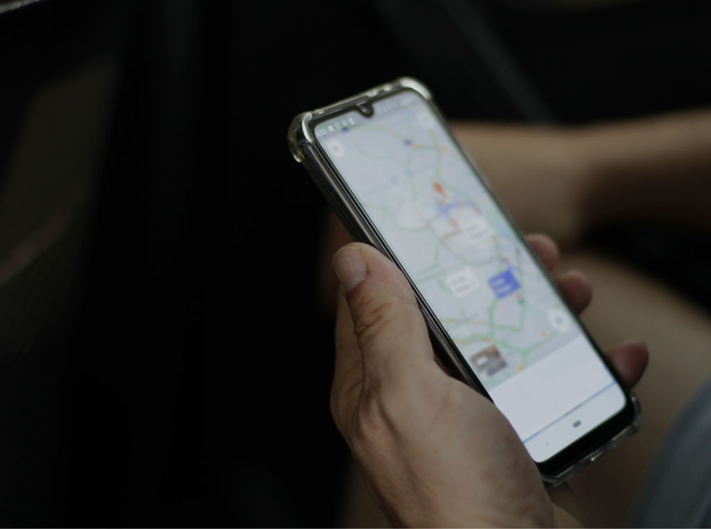 person getting digital TripTik directions from mobile app
