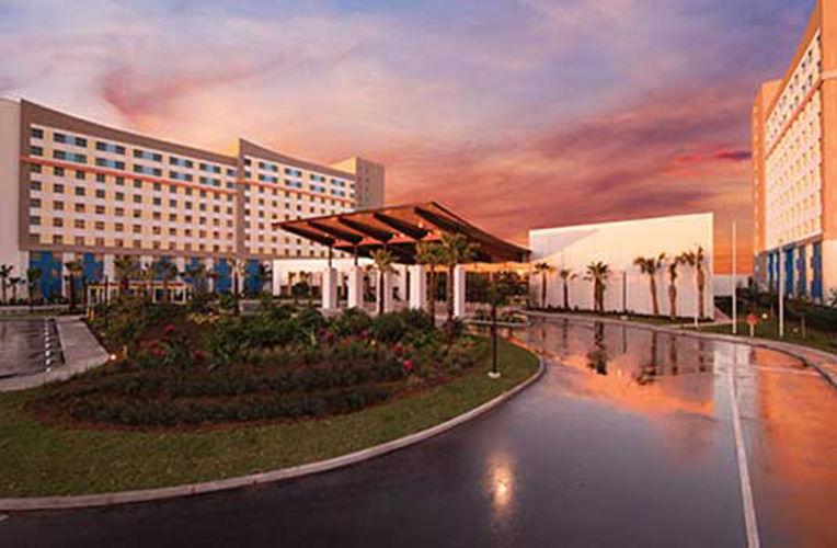 Beautiful view of the front of universal's endless summer resort dockside during a pink sunset.
