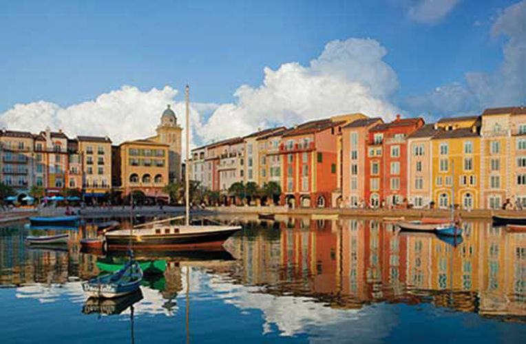 Daytime view of universal's loews portofino bay hotel dockside with boats in the water.