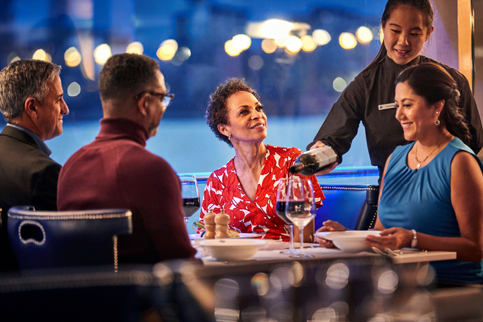 Cruise passengers enjoying a meal together on a Uniworld river cruise
