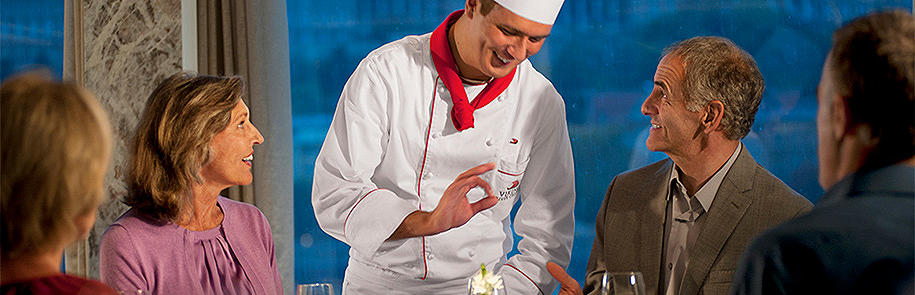 Cruise ship chef visiting a table