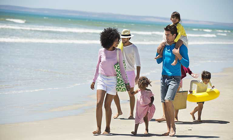 Family walking on the beach