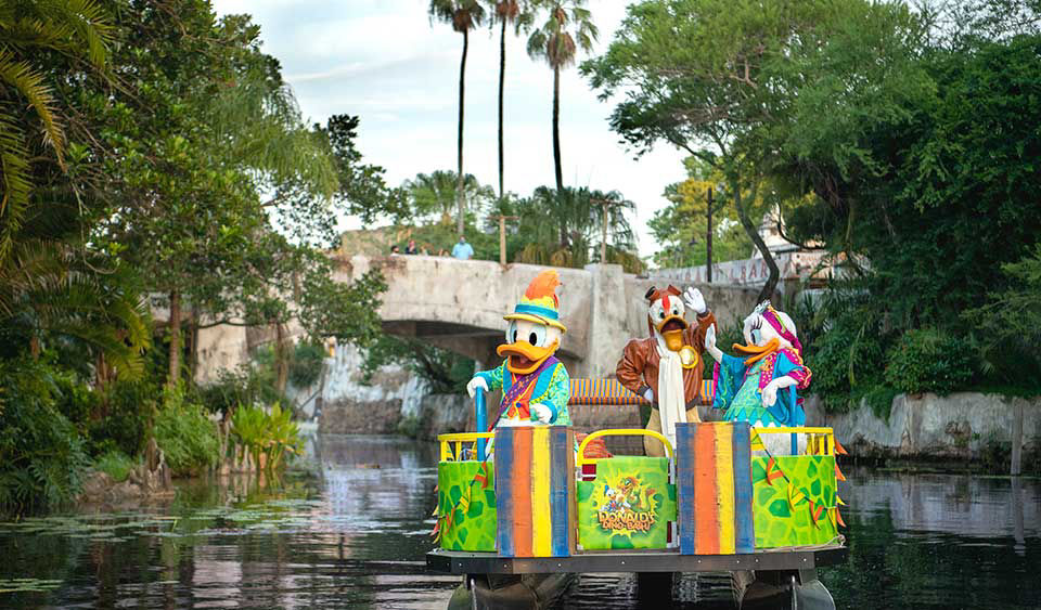 Donald and daisy duck sail down the river at walt disney world.